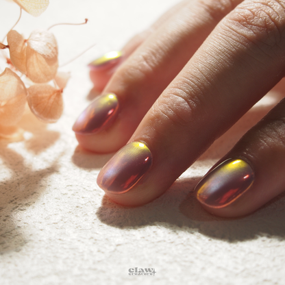 Iridescent Sunset Handmade Press-on Nails display on hand by Claw Creature