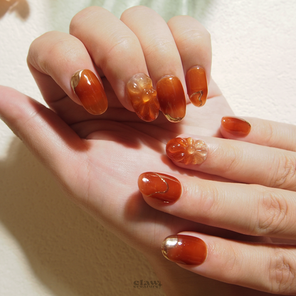 Amber Blossom Handmade Press-on Nails on hand by Claw Creature