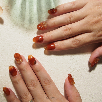 Amber Blossom Handmade Press-on Nails on hand by Claw Creature