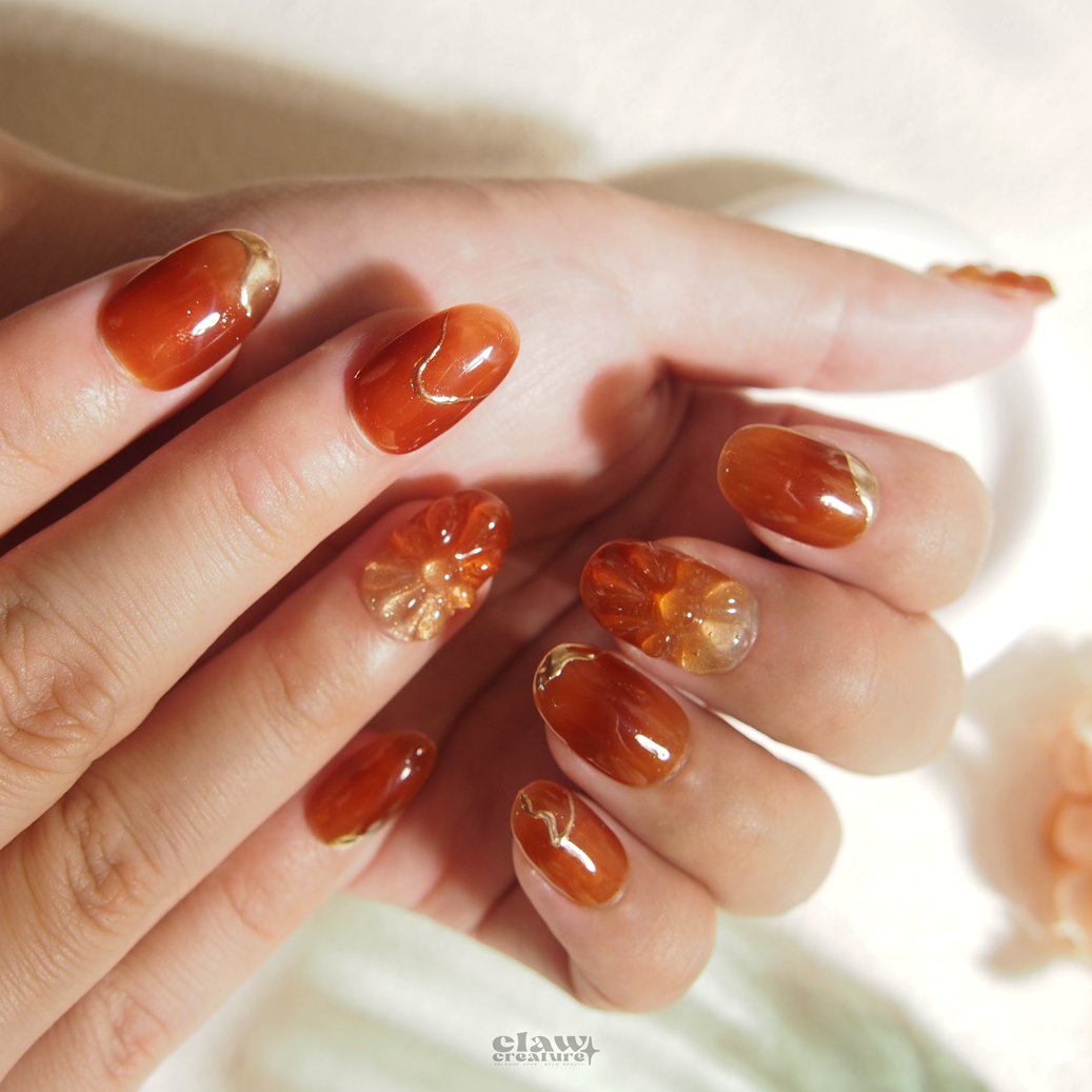 Amber Blossom Handmade Press-on Nails on hand by Claw Creature