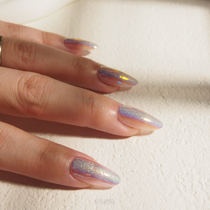 Iridescent Gleam Handmade Press-on Nails display on hand by Claw Creature