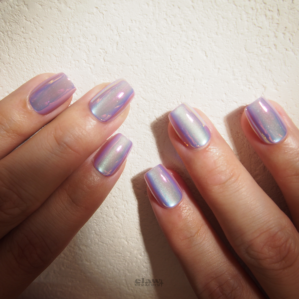 Lilac Luminescence Handmade Press-on Nails display on hand by Claw Creature