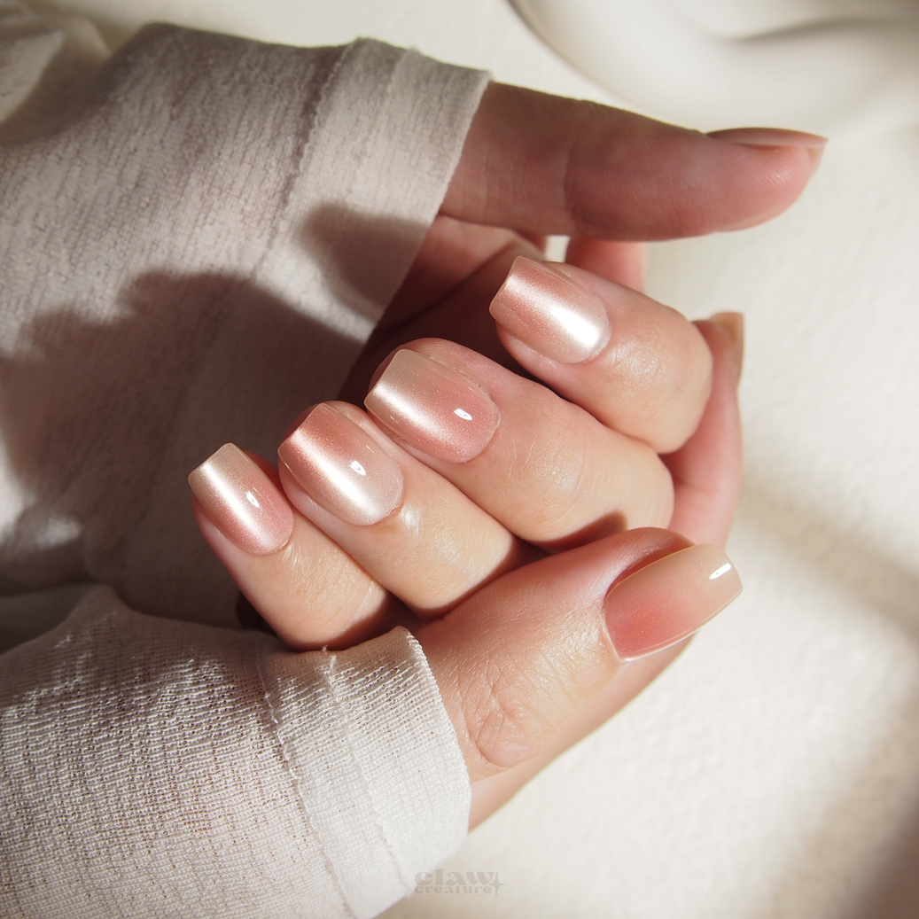 Peach Ombre Handmade Press-on Nails display on hand by Claw Creature