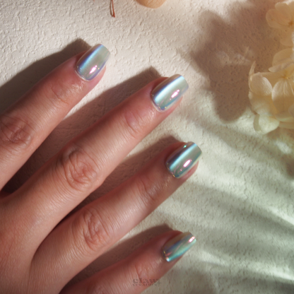 Sea Breeze Iridescent Handmade Press-on Nails display on hand by Claw Creature