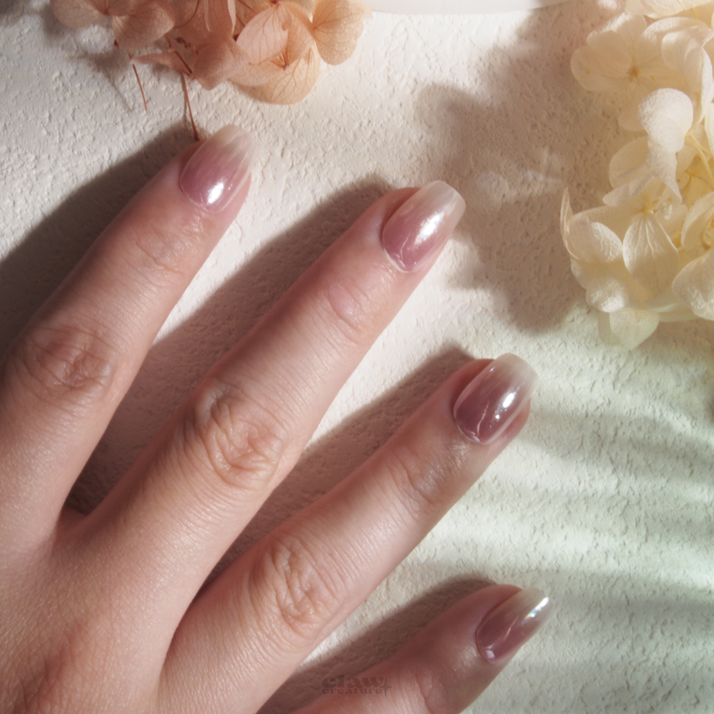 Rosy Ombre Handmade Press-on Nails display on hand by Claw Creature