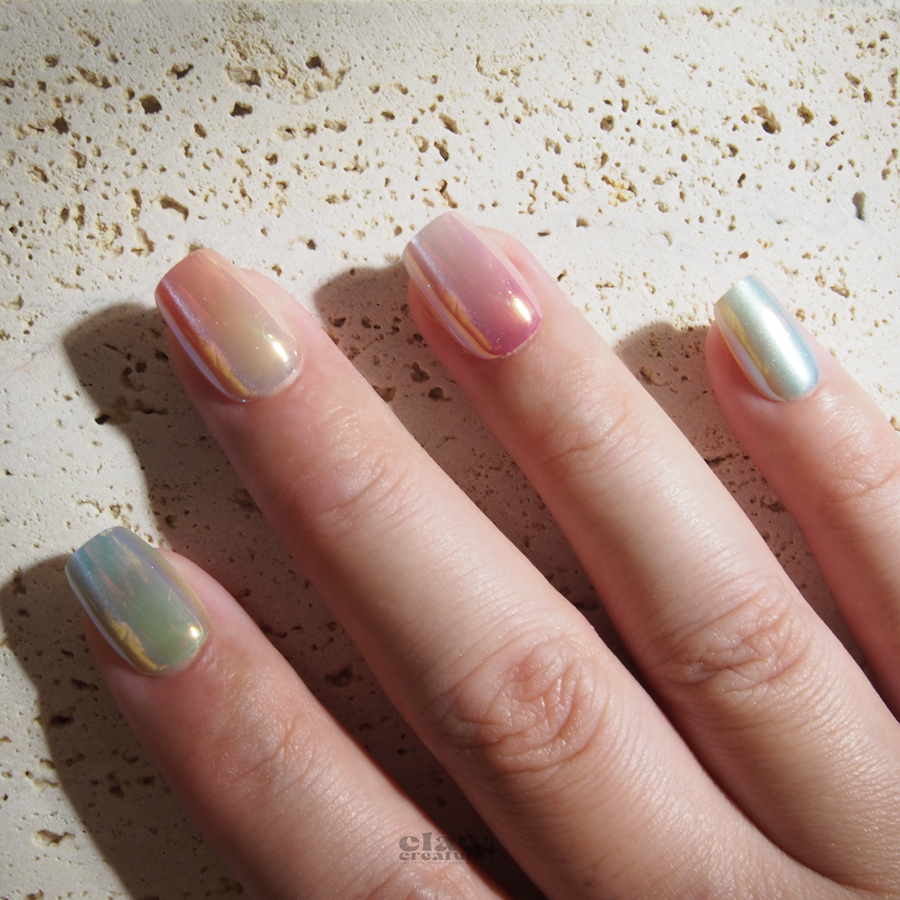 Pastel Prism Handmade Press-on Nails display on hand by Claw Creature