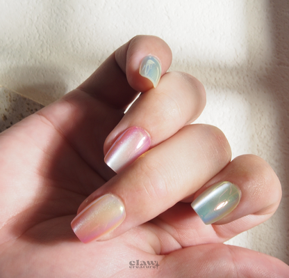 Pastel Prism Handmade Press-on Nails display on hand by Claw Creature